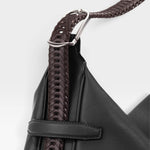 JONES + CO Rider M Elche black leather bag with a unique hand-braided dark brown strap and silver hardware detail.