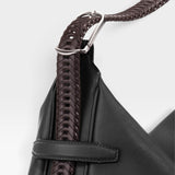 JONES + CO Rider M Elche black leather bag with a unique hand-braided dark brown strap and silver hardware detail.