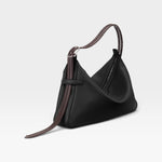 JONES + CO Rider M Elche black leather bag with a unique architectural shape and a decorative hand-braided strap.