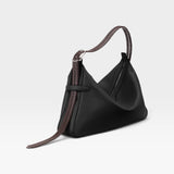 JONES + CO Rider M Elche black leather bag with a unique architectural shape and a decorative hand-braided strap.