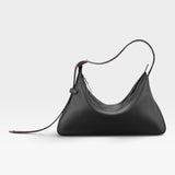 JONES + CO Rider M Elche black leather shoulder bag with a unique architectural shape and hand-braided strap.