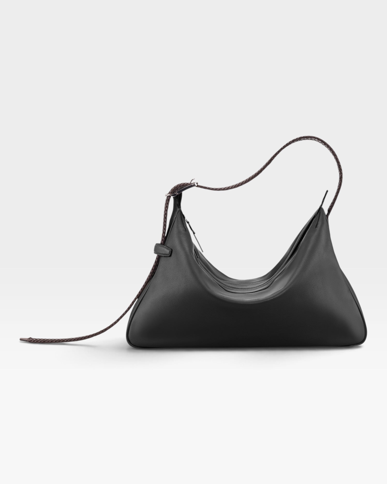 JONES + CO Rider M Elche black leather shoulder bag with a unique architectural shape and hand-braided strap.
