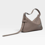 JONES + CO Rider S taupe soft calf leather shoulder bag with adjustable belt-style strap and palladium hardware