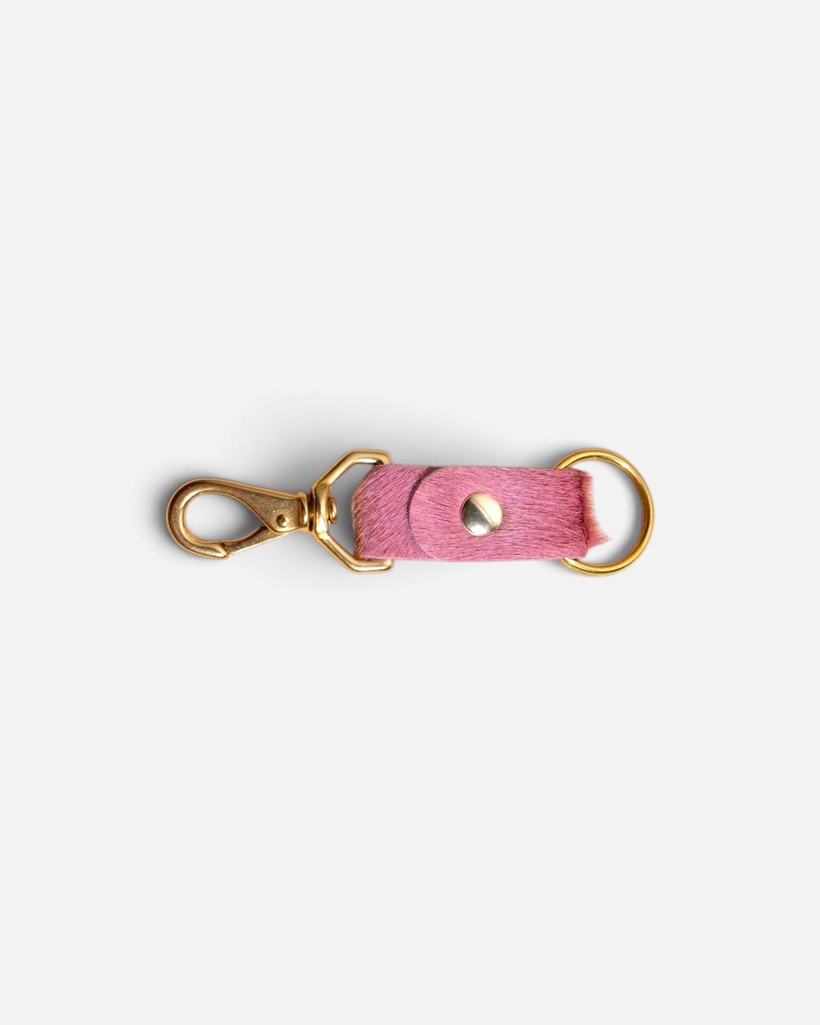 JONES + CO rose cowhide keychain with gold-tone metal clasp and ring on a light background