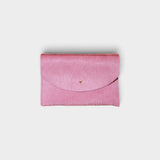 JONES + CO rose cowhide envelope pouch with a solid brass stud fastener, handmade in Portland.