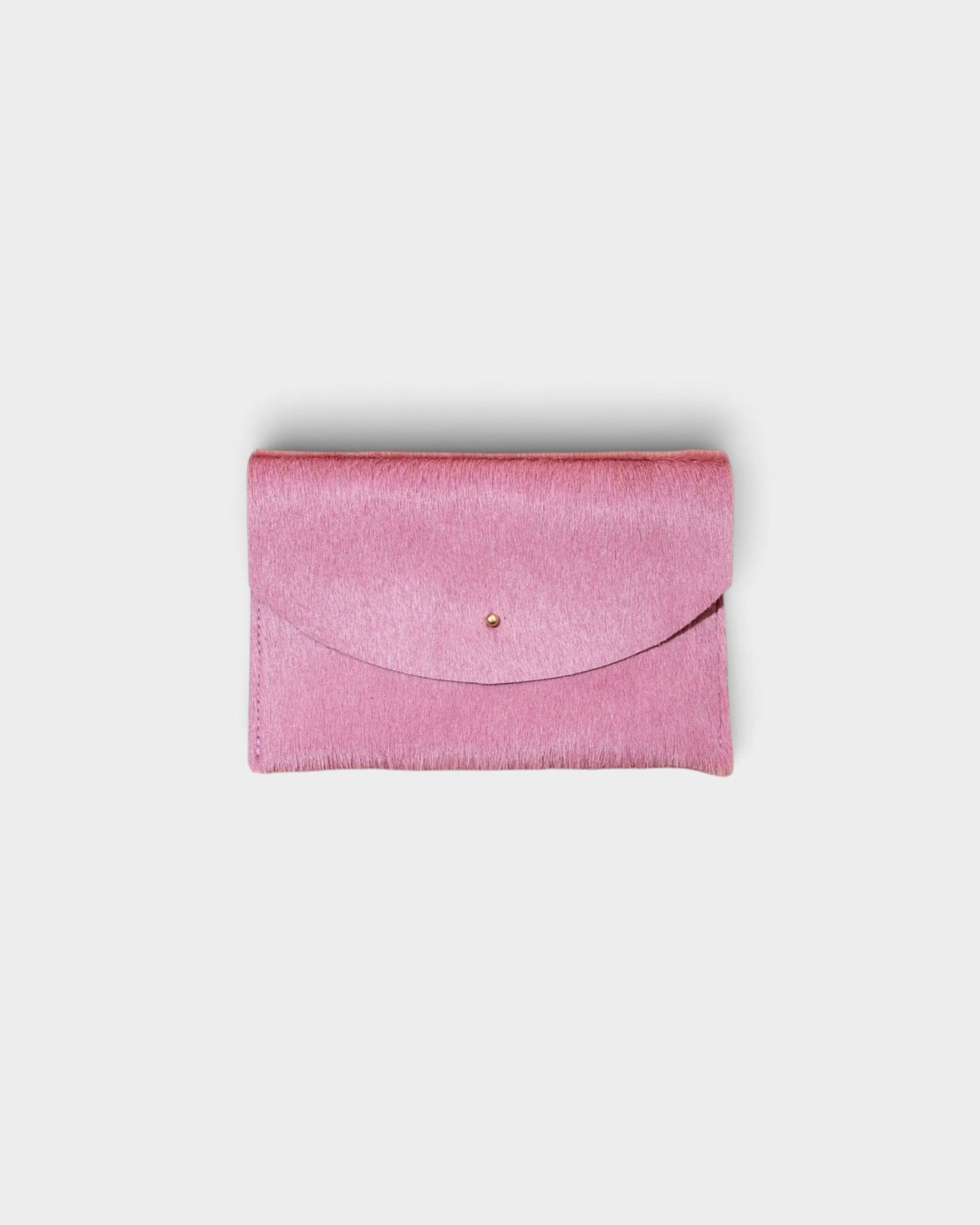 JONES + CO rose cowhide envelope pouch with a solid brass stud fastener, handmade in Portland.
