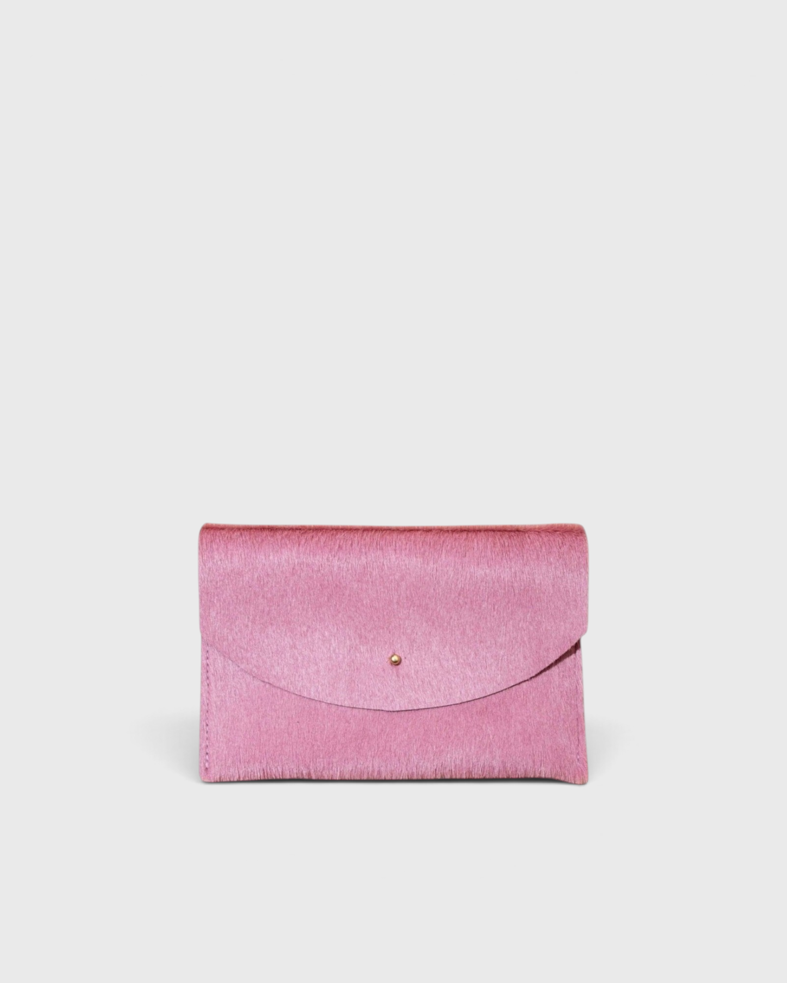 JONES + CO rose cowhide envelope pouch with a solid brass stud fastener, handmade in Portland.