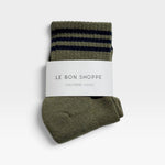 JONES + CO Le Bon Shoppe sage green crew socks with navy blue varsity stripes in branded paper packaging