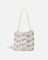 JONES + CO Mini Web Bag in silver featuring intricate leather macrame weaving and decorative bamboo beads.