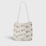 JONES + CO Mini Web Bag in silver featuring intricate leather macrame weaving and decorative bamboo beads.