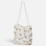 JONES + CO Mini Web Bag in silver featuring intricate macrame leather weaving and decorative bamboo beads