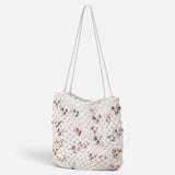 JONES + CO Mini Web Bag in silver featuring intricate macrame leather weaving and decorative bamboo beads
