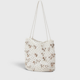 JONES + CO Mini Web Bag in silver featuring intricate macrame leather weaving and decorative bamboo beads
