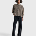 Model wearing a JONES + CO smoky hazelnut acid-overdyed cropped sweatshirt with raw-edge hem and dropped shoulders.