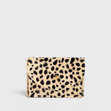 JONES + CO cardholder in beige and black spotted cowhide leather with a gold button closure.