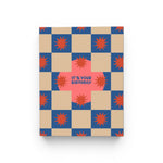 JONES + CO Squares and Bursts birthday card with blue and beige checkerboard pattern and red starburst illustrations.
