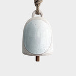 JONES + CO small round stoneware bell in full moon white with a wood knocker and natural hemp rope hanger