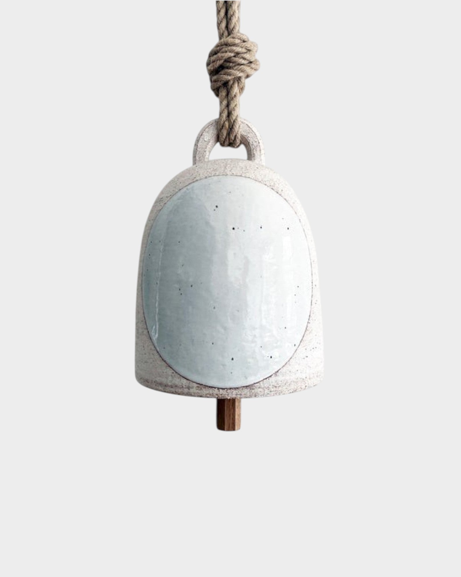 JONES + CO small round stoneware bell in full moon white with a wood knocker and natural hemp rope hanger