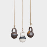 JONES + CO stoneware jingle bells in round XS size with hand-painted rings on natural hemp rope hanging ornaments.