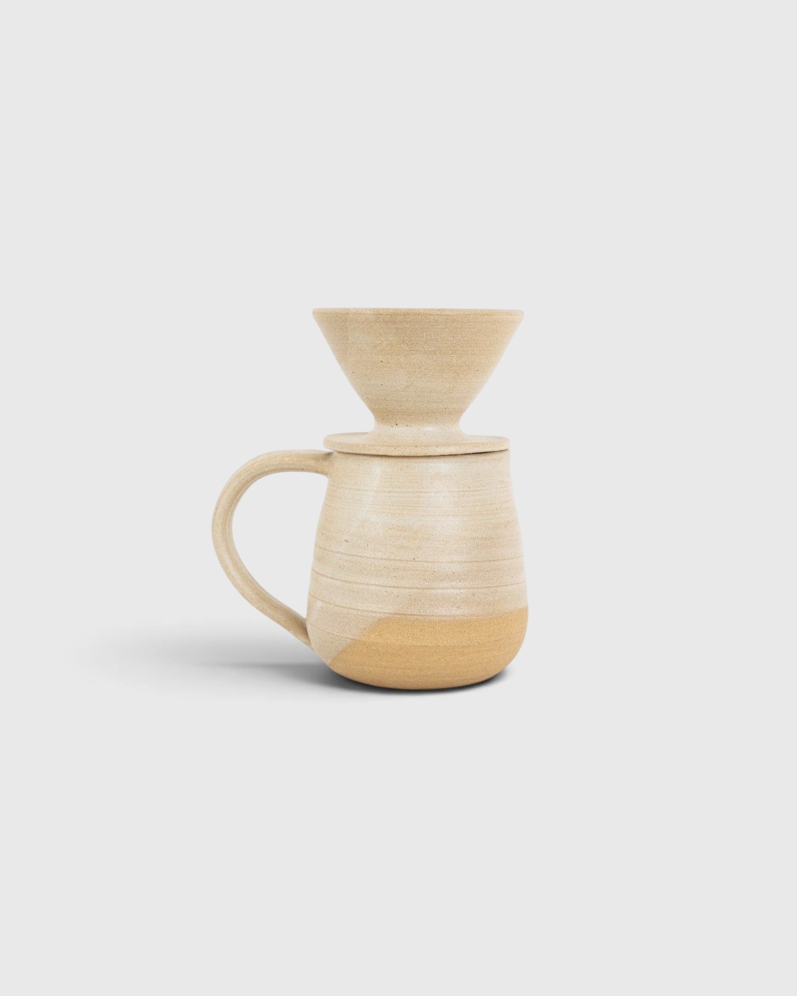 JONES + CO handmade stoneware pitcher and pour over coffee set with a soft glaze and exposed raw clay base.