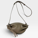 JONES + CO Bon-Bon taupe bovine leather shoulder bag with pleated ends, adjustable strap, and silver metal hardware.