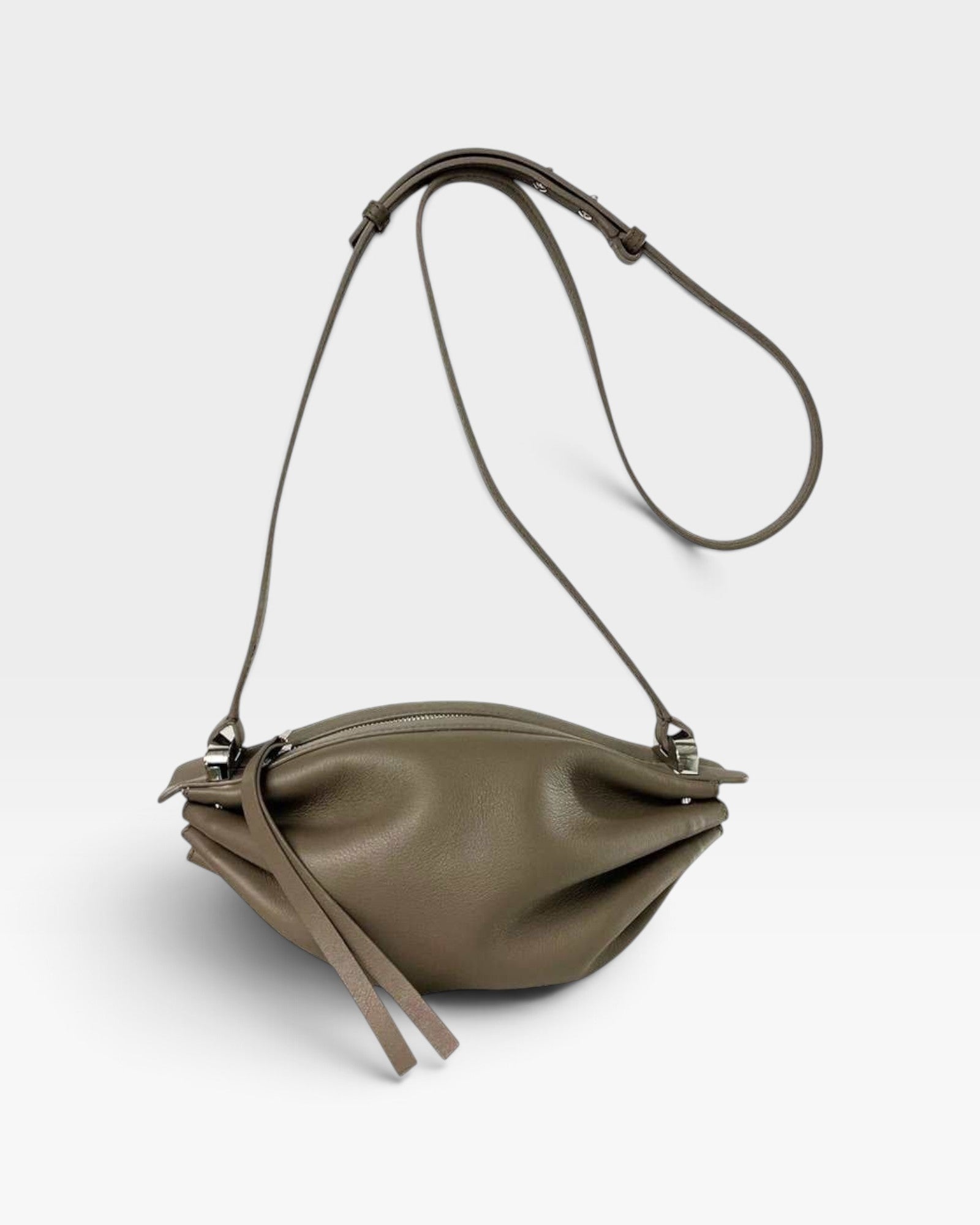 JONES + CO Bon-Bon taupe bovine leather shoulder bag with pleated ends, adjustable strap, and silver metal hardware.