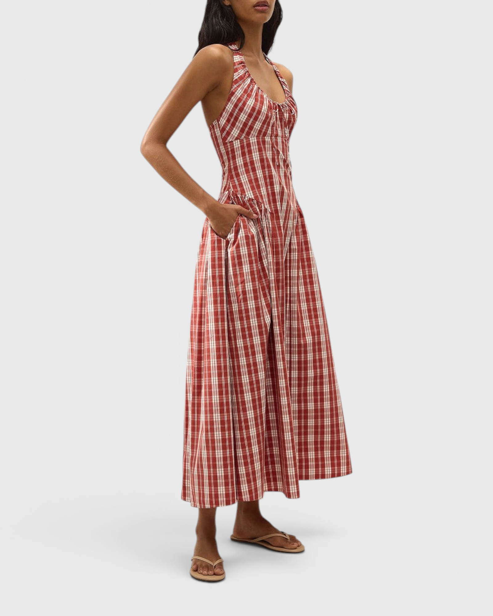 JONES + CO Del Rose midi dress in terra rosso check cotton with halterneck, front tie, and A-line skirt on a model.