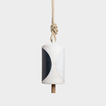 JONES + CO Thrown Bell in Domino Indigo featuring a cylindrical ceramic body with a bold black and white pattern.