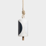 JONES + CO Thrown Bell in Domino Indigo featuring a cylindrical ceramic body with a bold black and white pattern.