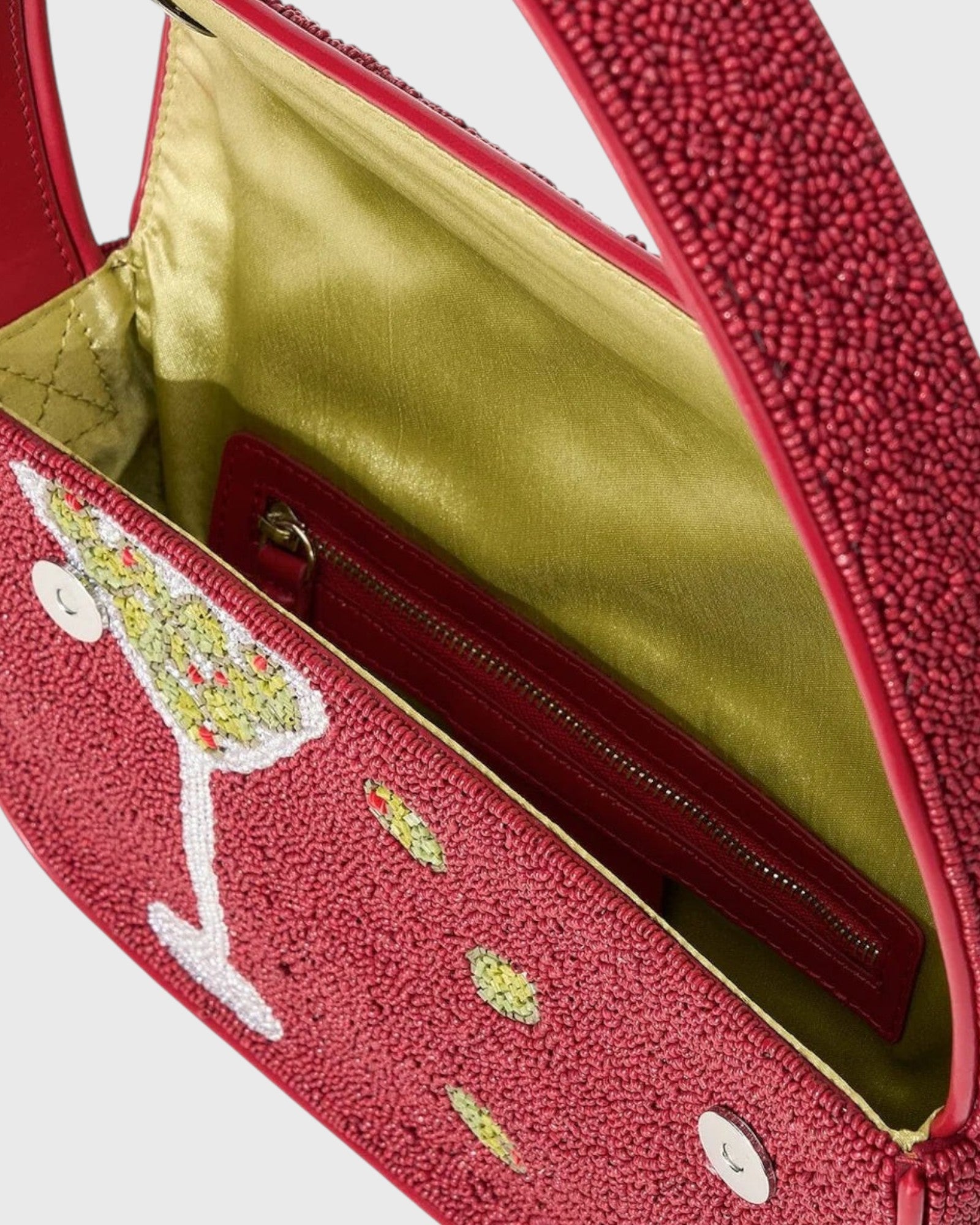 JONES + CO Tommy beaded shoulder bag in red with martini glass design, vegan leather piping, and olive green lining.
