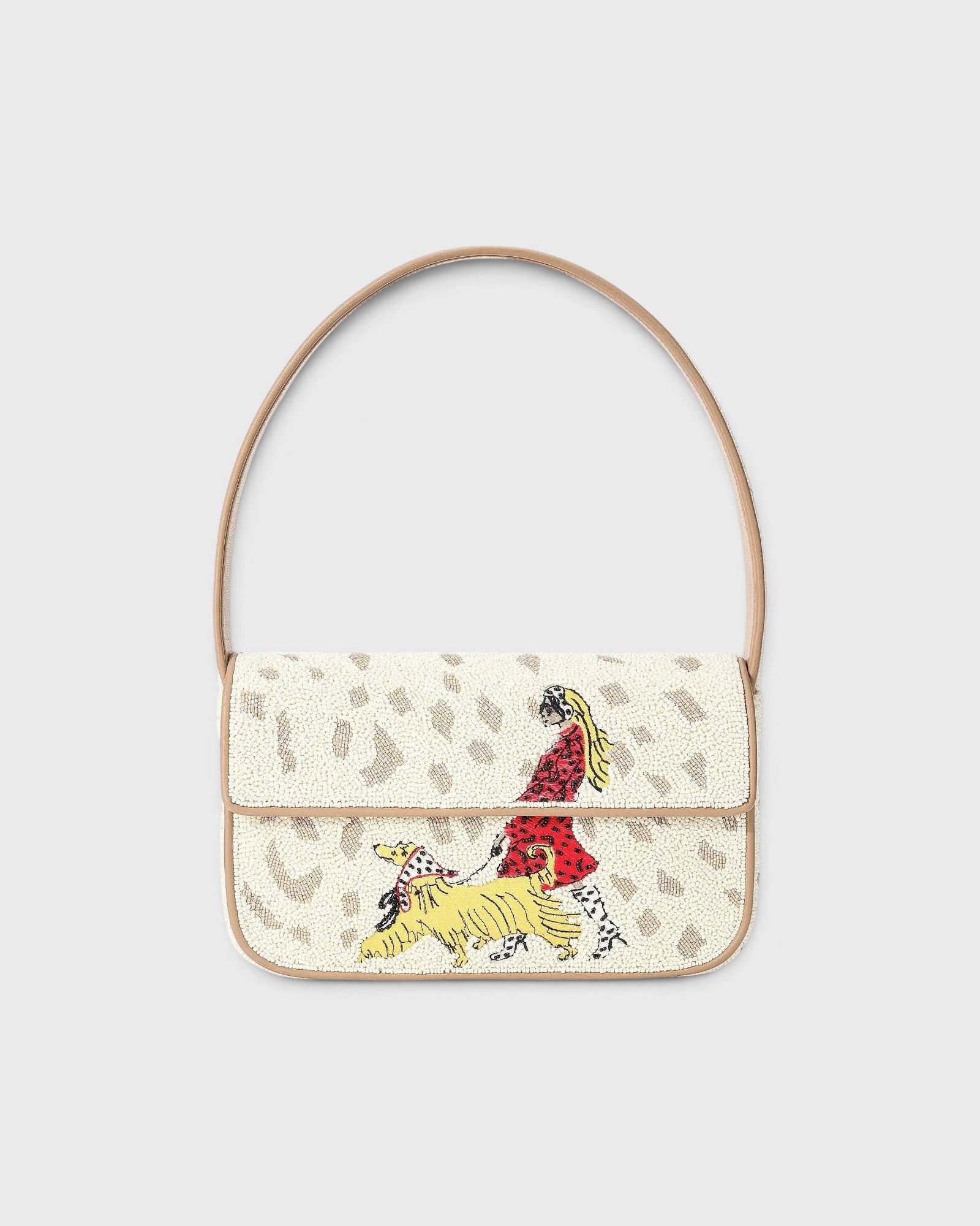 JONES + CO Tommy shoulder bag featuring hand-beaded dog walk design on cream background with vegan leather piping.