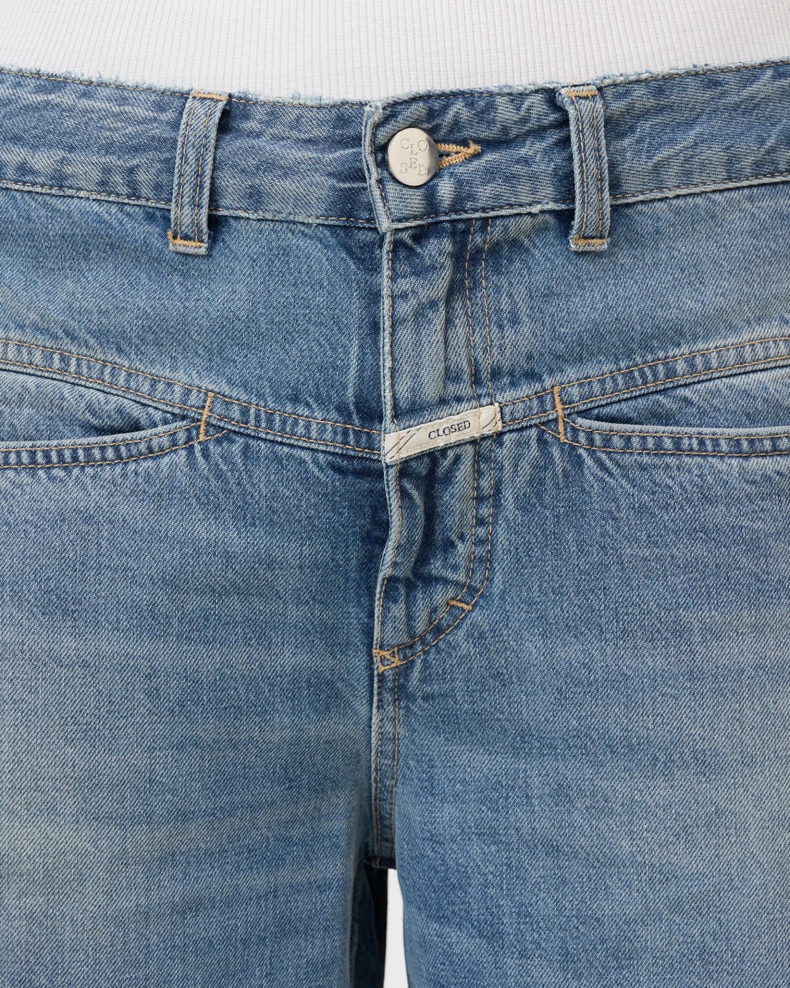JONES + CO Tori-X barrel jeans in mid blue denim featuring signature X-pockets and offset side seams.