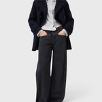 JONES + CO Tori X dark gray barrel fit denim jeans with iconic X-pockets and offset side seams on a model