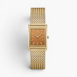 JONES + CO Virgil Small watch featuring a gold rectangular case, ochre dial, and woven mesh bracelet.