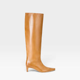 JONES + CO Wally knee-high boot in distressed cashew leather with a pointed toe and slim kitten heel.