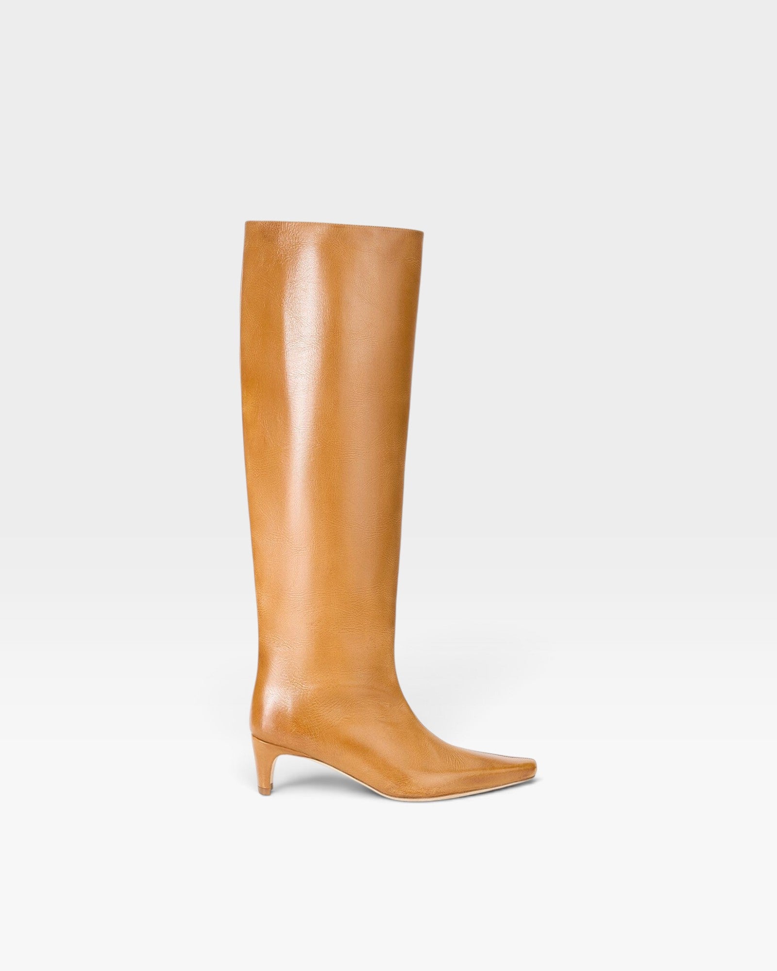 JONES + CO Wally knee-high boot in distressed cashew leather with a pointed toe and slim kitten heel.