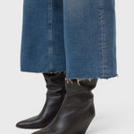 JONES + CO Wera mid blue denim jeans featuring a wide-leg cropped culotte silhouette with a raw frayed hem
