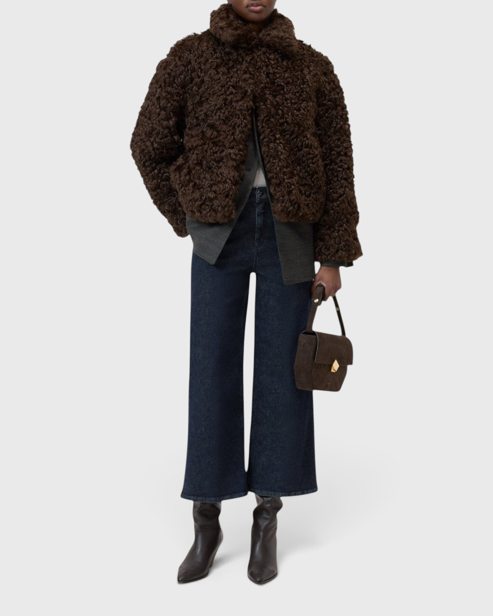 JONES + CO Wera dark blue high-waisted wide-leg cropped stretch denim jeans worn with a brown curly faux fur jacket