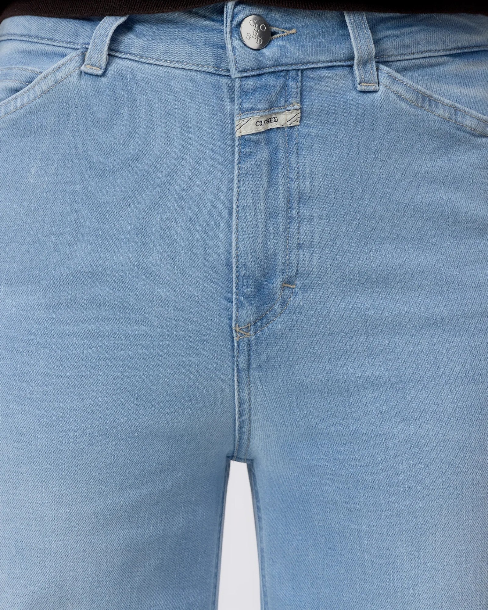 JONES + CO Wera light blue super-stretch denim jeans with a high waist and button fly detail.