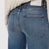 JONES + CO Wera mid blue denim jeans featuring iconic X-pockets and a high-waisted wide-leg silhouette.
