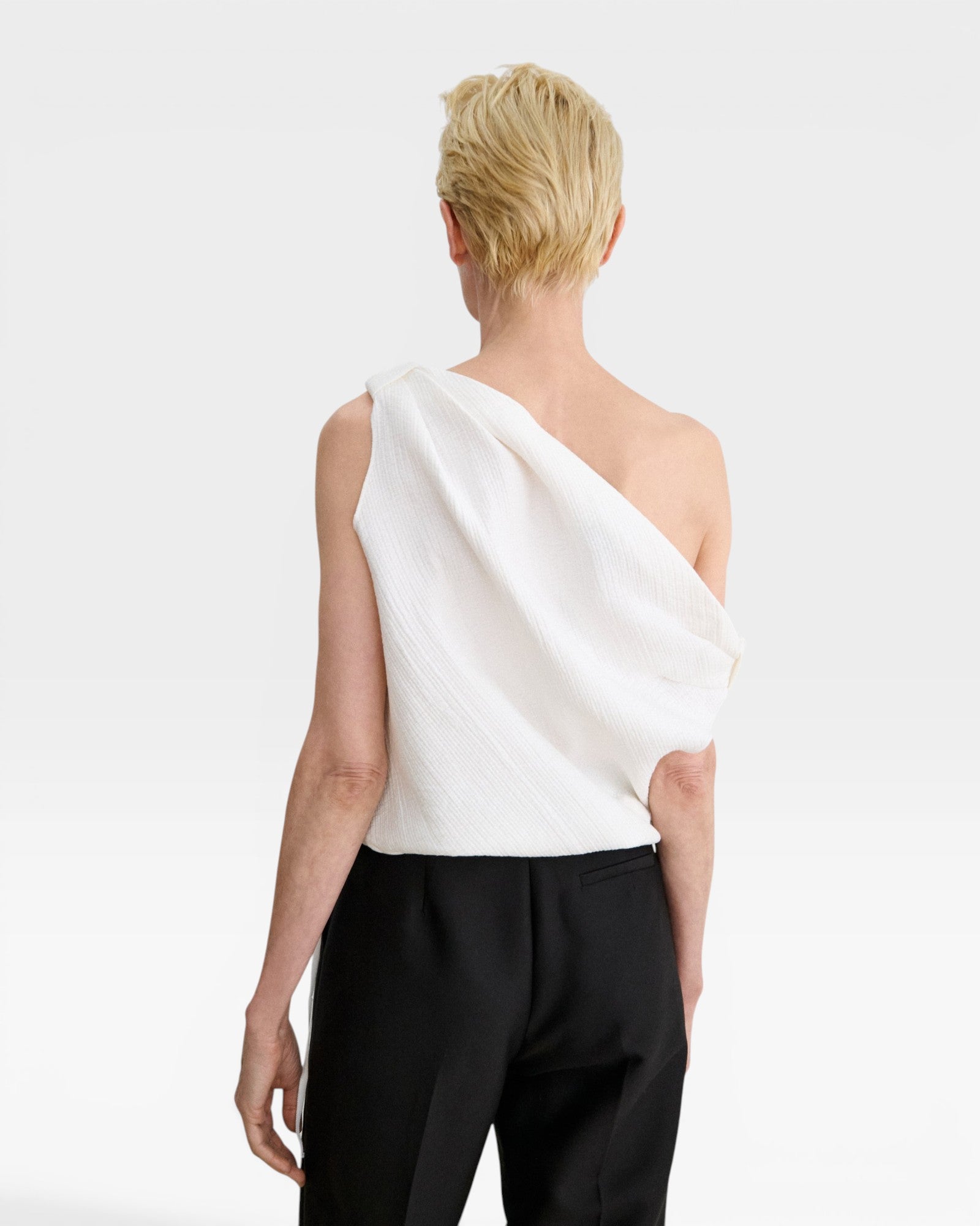 JONES + CO white one-shoulder Farfalla top in sculptural Italian Foam fabric with draped gathered shoulder detail