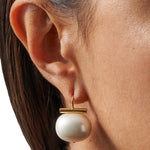 JONES + CO white pebble pearl statement earring with 14k gold over brass wire worn on ear