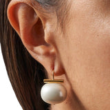 JONES + CO white pebble pearl statement earring with 14k gold over brass wire worn on ear