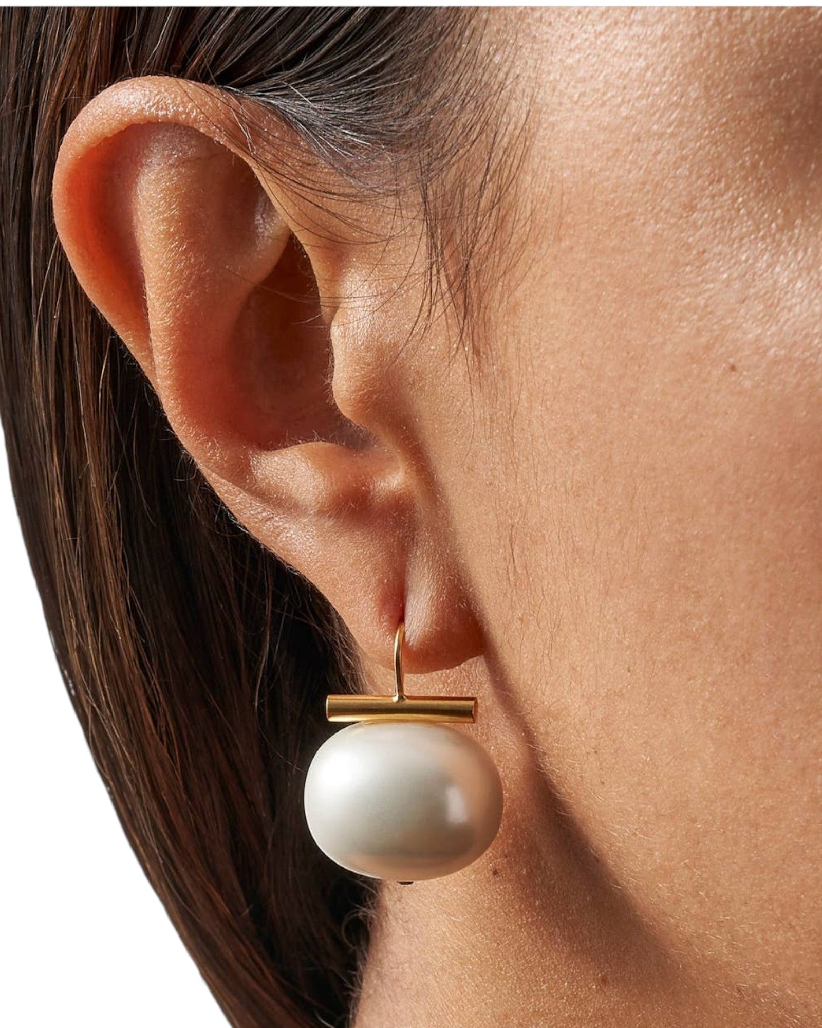JONES + CO white pebble pearl statement earring with 14k gold over brass wire worn on ear