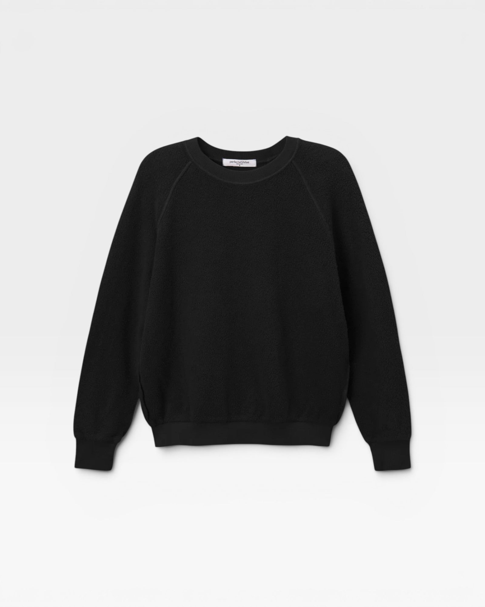 JONES + CO Ziggy sweatshirt in true black with a shrunken fit and textured fabric, featuring cropped sleeves.
