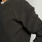 JONES + CO Ziggy sweatshirt in vintage black featuring a textured fleece fabric and ribbed crew neck collar.