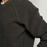 JONES + CO Ziggy sweatshirt in vintage black featuring a textured fleece fabric and ribbed crew neck collar.