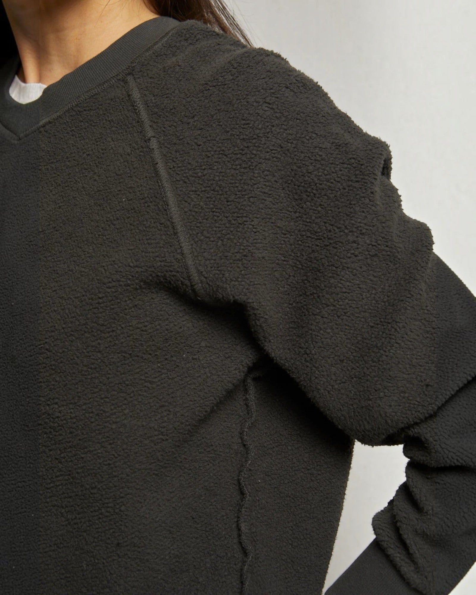 JONES + CO Ziggy sweatshirt in vintage black featuring a textured fleece fabric and ribbed crew neck collar.