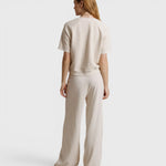 JONES + CO Ziggy short sleeve sweatshirt in sugar cream with raglan sleeves, worn with matching wide-leg trousers