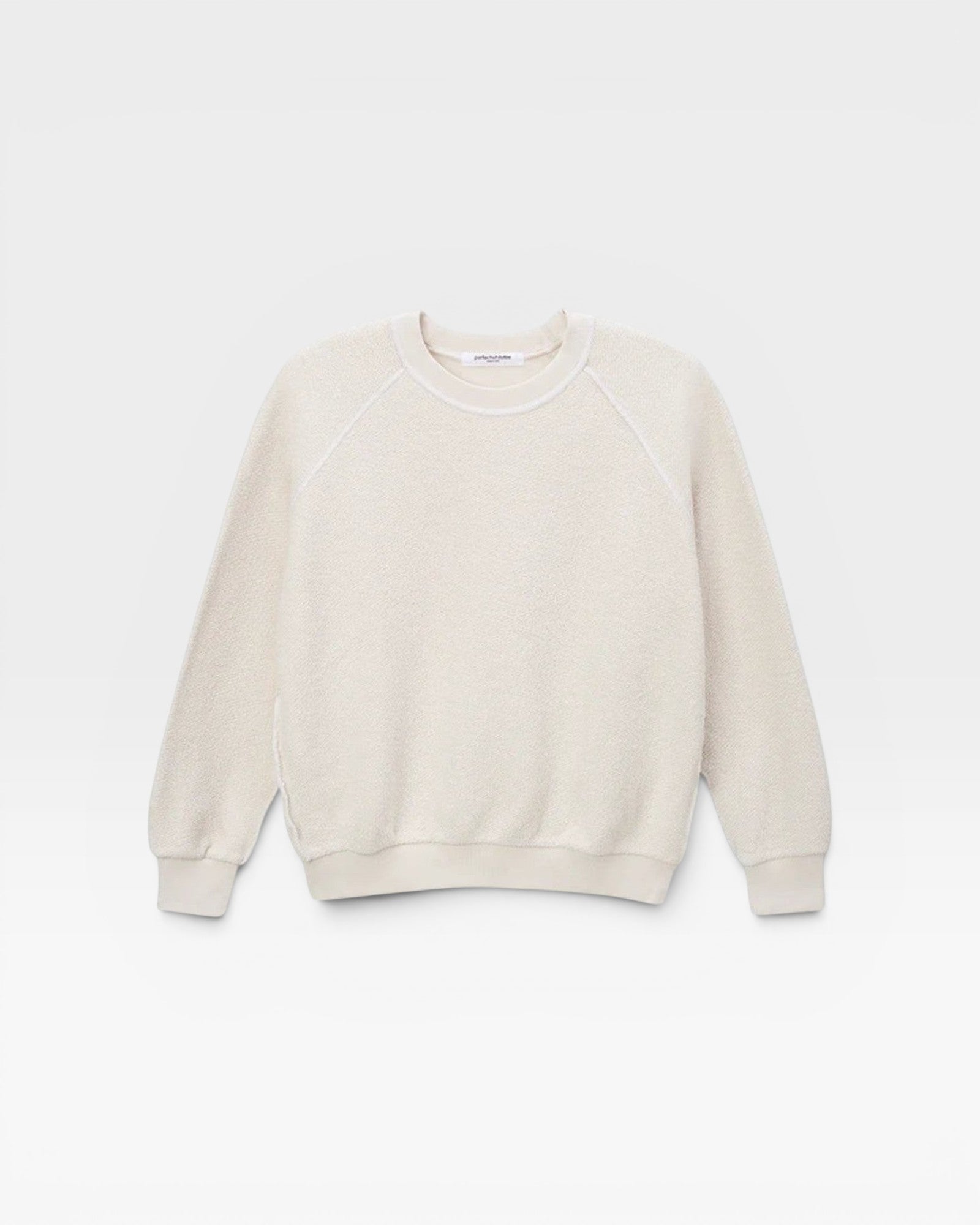 JONES + CO Ziggy sweatshirt in sugar off-white with a textured finish and cropped sleeves on a plain background.